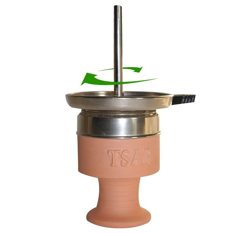 Hogar de terracota con chimenea de rejilla metálica