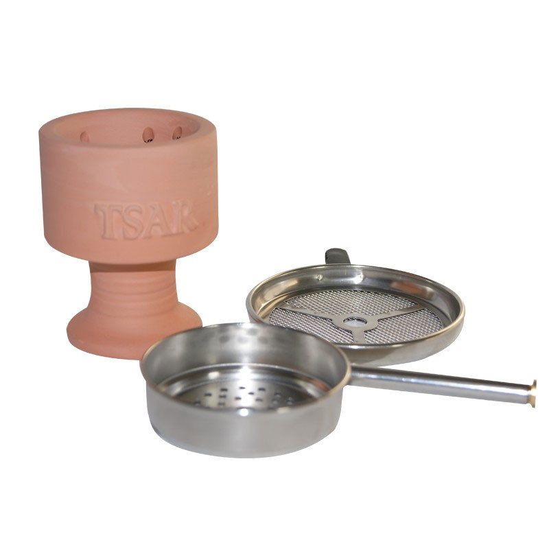 Hogar de terracota con chimenea de rejilla metálica